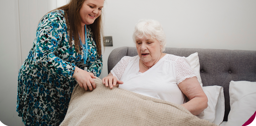 carer in berkshire assisting elderly woman at home after a hip operation