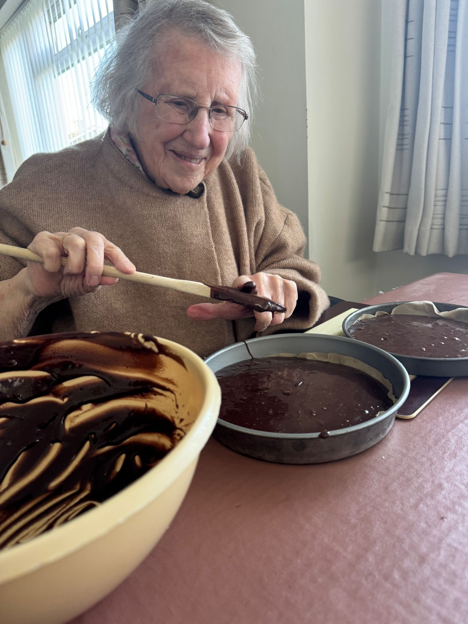 A clients is making a chocolate cake