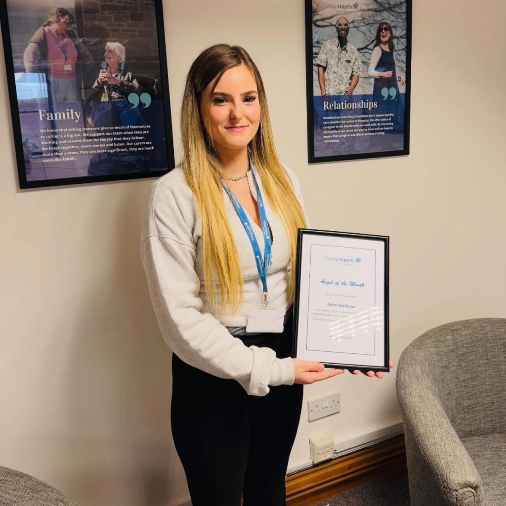 Visiting Angels Lincolnshire caregiver receiving Angel of the Month award after helping save a client's life through quick thinking and compassionate care.