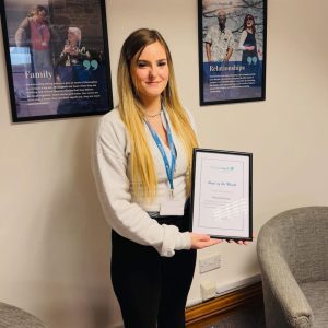 Visiting Angels Lincolnshire caregiver receiving Angel of the Month award after helping save a client's life through quick thinking and compassionate care.