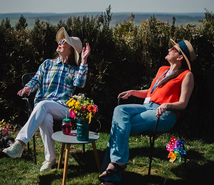 A Visiting Angels carer and client enjoying outdoor Wellbeing Care activities in Cassiobury, Middlesex — friendly, professional, CQC registered home care