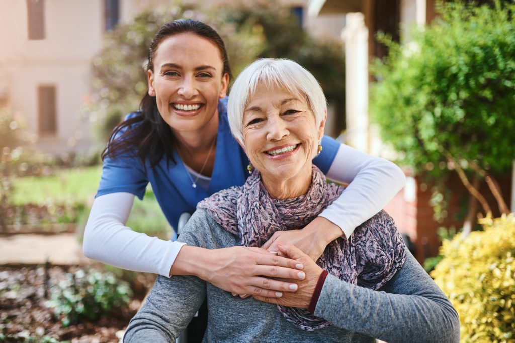 A trusted Visiting Angels carer delivering dignified personal care support to an elderly woman in her Middlesex home, maintaining her independence and comfort