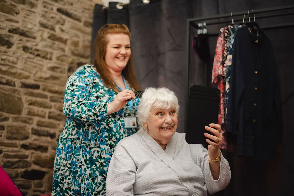 A Visiting Angels carer providing companionship care to an elderly woman at home in Abingdon, Oxfordshire — compassionate, professional, CQC rated home care