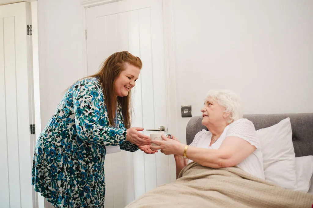 A Visiting Angels carer providing home care support to an elderly woman at home in Summertown, Oxfordshire — compassionate, professional, CQC rated home care