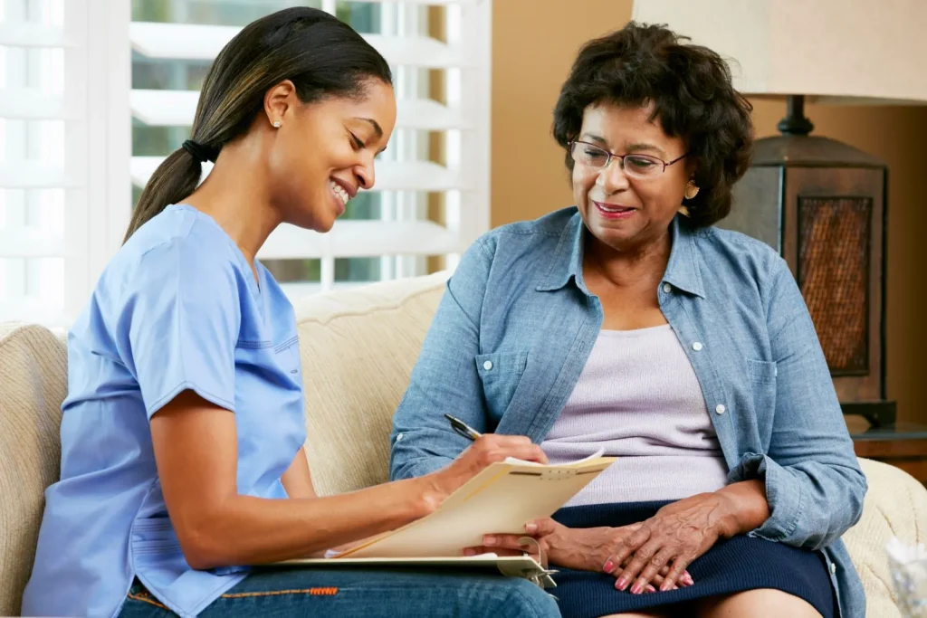 A Visiting Angels carer providing home care support to an elderly woman at home in Oxford, Oxfordshire — compassionate, professional, CQC rated home care