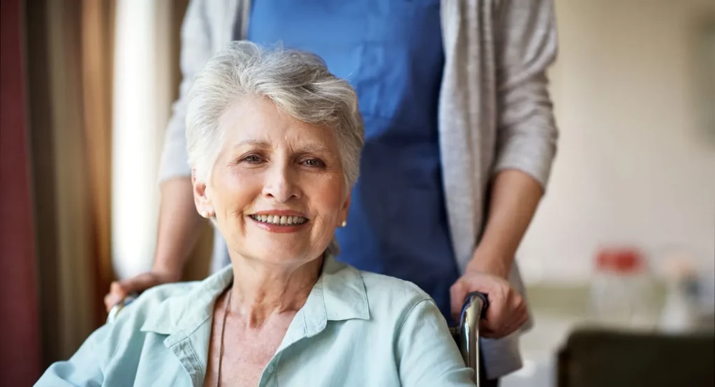 A Visiting Angels carer providing personal care and summer safety support to an elderly woman at home in Oxford, Oxfordshire — compassionate, professional, CQC rated home care