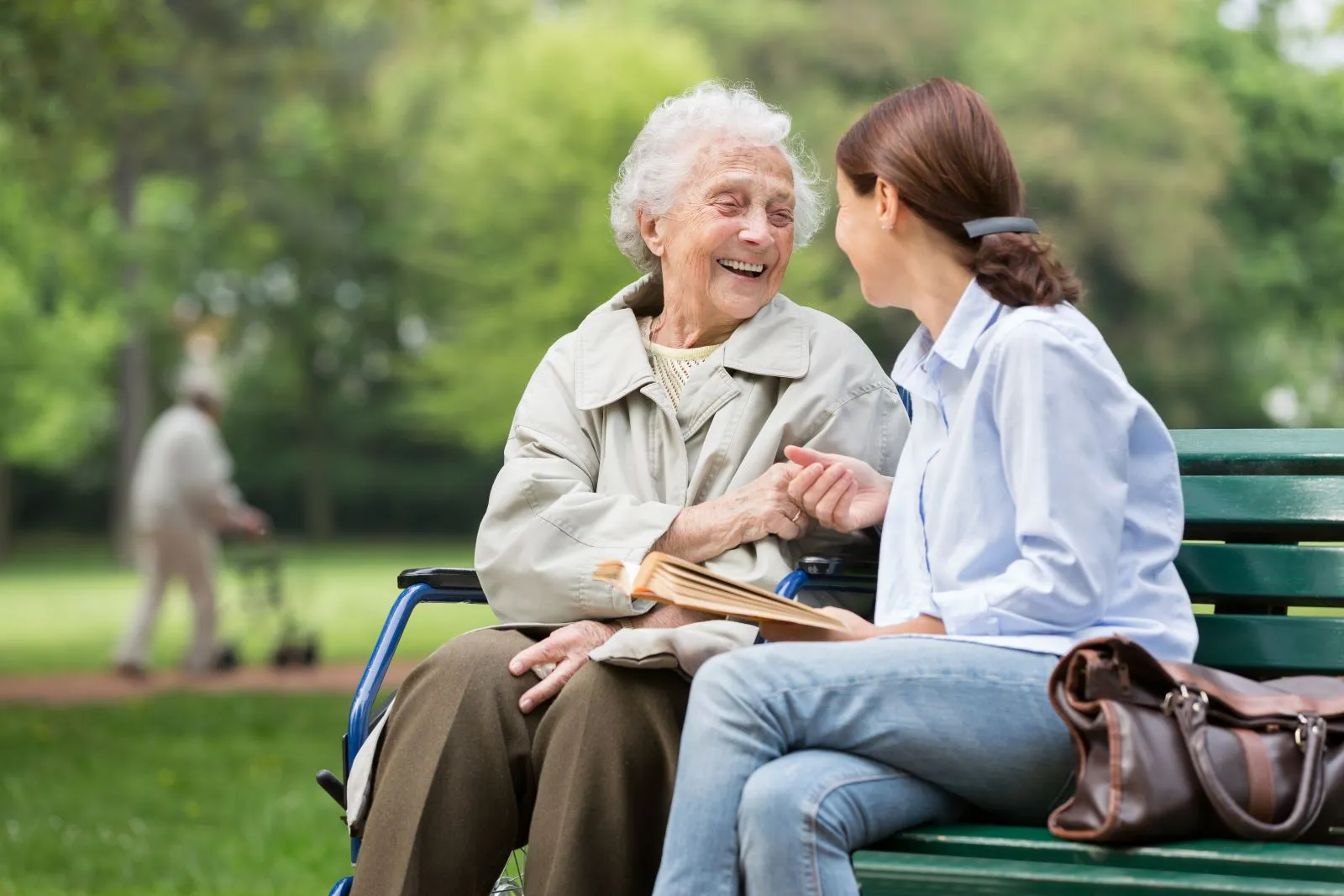 A Visiting Angels carer providing companionship care to an elderly woman outdoors in Oxford, Oxfordshire — compassionate, professional, CQC rated home care