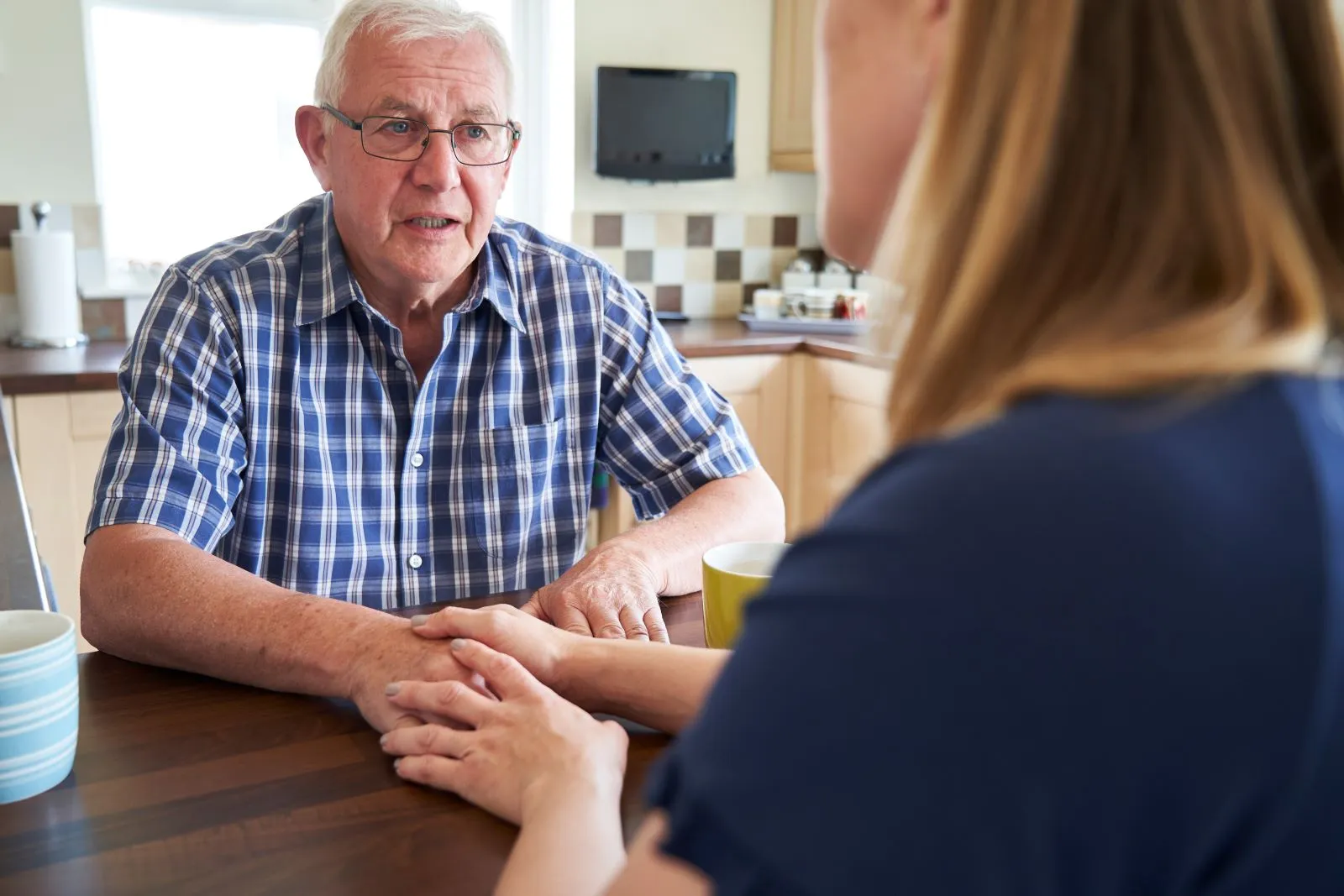 A Visiting Angels carer providing Alzheimer’s care to an elderly man at home in Wheatley, Oxfordshire — compassionate, professional, CQC Good rated home care