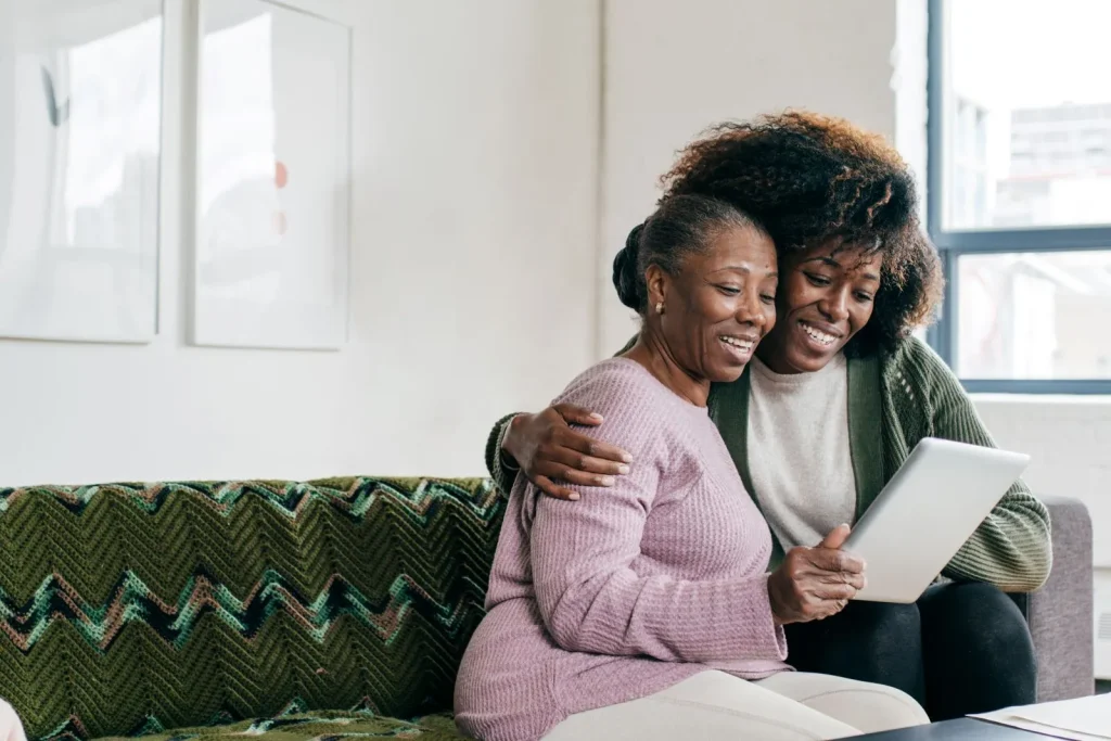 A Visiting Angels carer providing companionship care services to an elderly woman at home in Headington, Oxfordshire — compassionate, professional, CQC Good rated home care