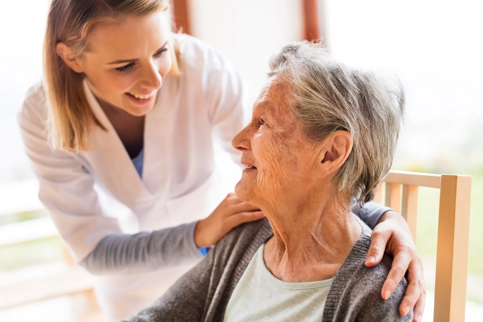 A Visiting Angels carer providing dementia care services to an elderly woman at home in Oxford, Oxfordshire — compassionate, professional, CQC Good rated home care