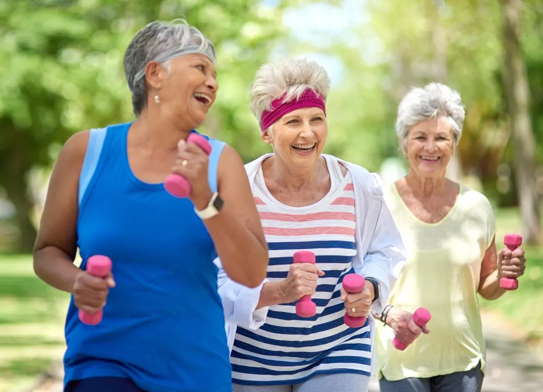 A Visiting Angels carer providing personal care and dementia support to elderly women at home in Abingdon, Oxfordshire — compassionate, professional, CQC rated home care