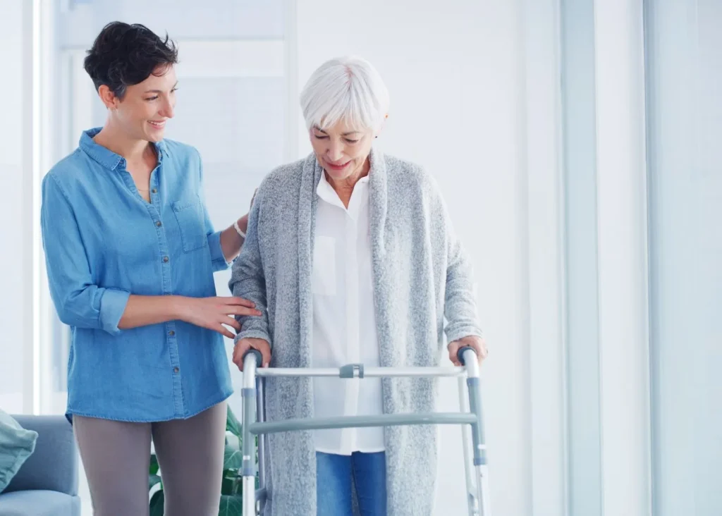 A Visiting Angels carer providing elderly care to an elderly woman at home in Thame, Oxfordshire — compassionate, professional, CQC Good rated home care