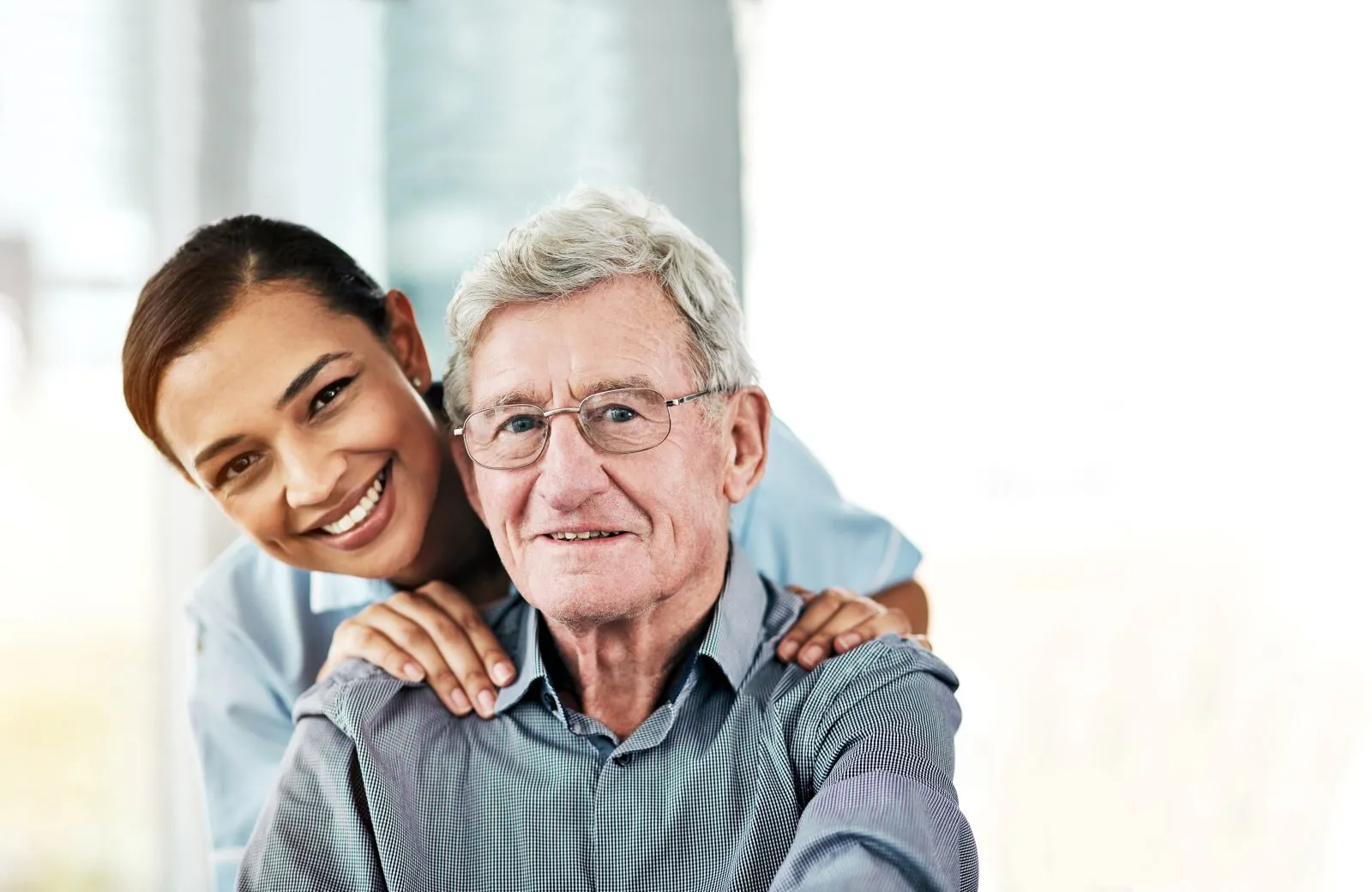 A Visiting Angels carer providing elderly care to an elderly man at home in Wheatley, Oxfordshire — compassionate, professional, CQC Good rated home care