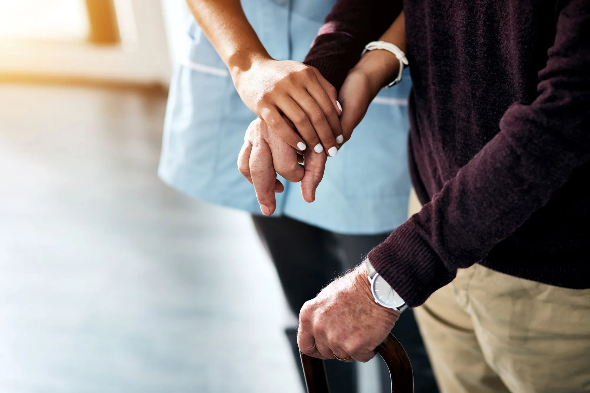 A Visiting Angels carer providing exercise and daily activities support to an elderly man at home in Oxford, Oxfordshire — compassionate, professional, CQC rated home care