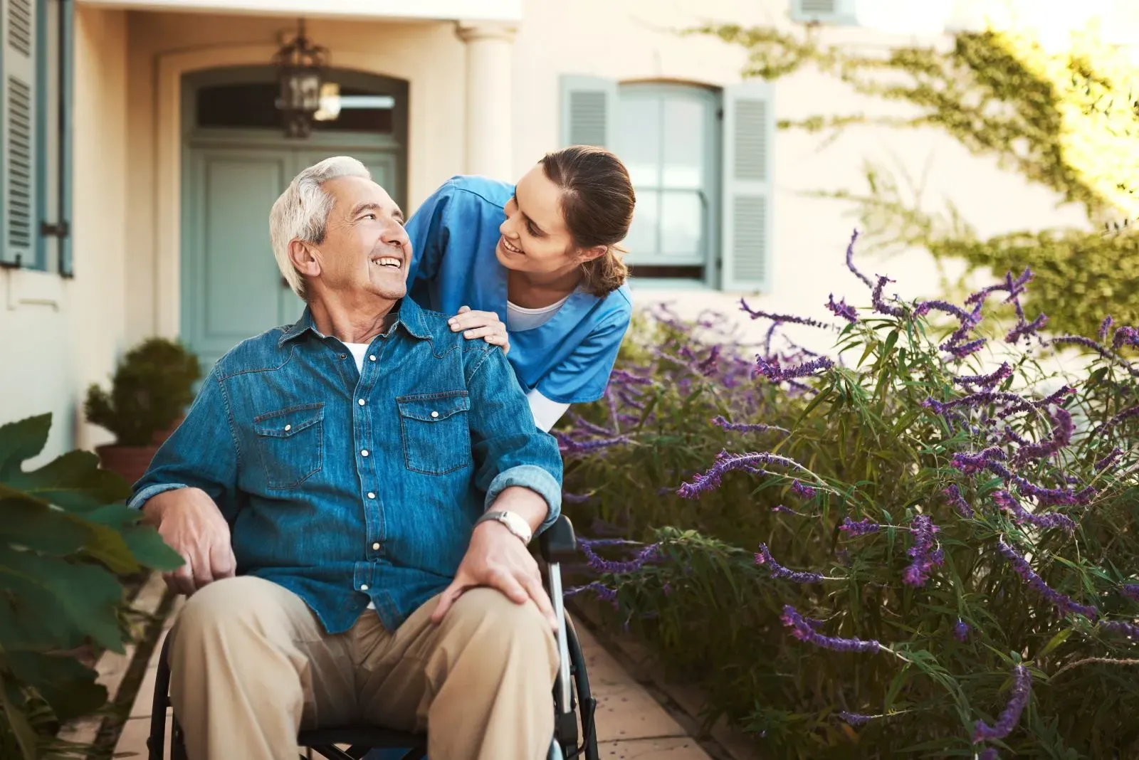 A Visiting Angels carer providing heatwave safety support to an elderly man at home in Oxfordshire — compassionate, professional, CQC Good rated home care