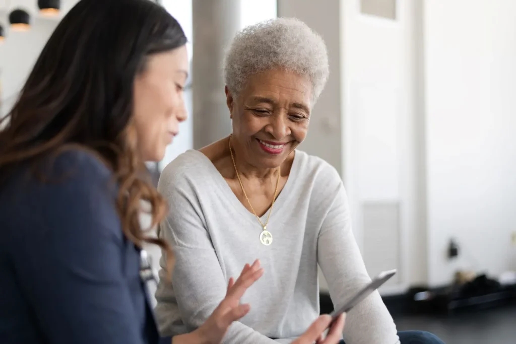 A Visiting Angels carer providing home care agency support to an elderly woman in Kidlington, Oxfordshire — compassionate, professional, CQC Good rated care