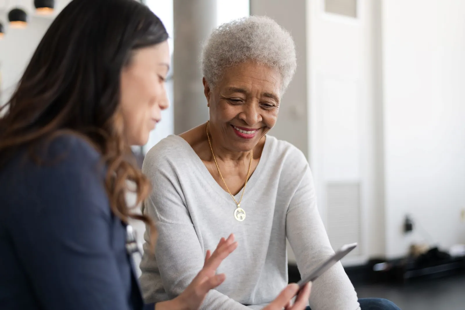 A Visiting Angels carer providing home care agency support to an elderly woman in Kidlington, Oxfordshire — compassionate, professional, CQC Good rated care