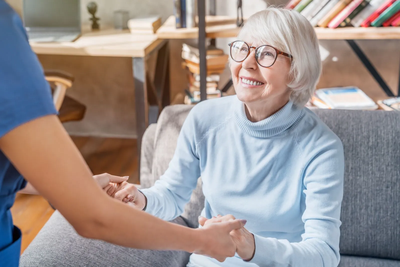 A Visiting Angels carer providing home care agency support to an elderly woman at home in Abingdon, Oxfordshire — compassionate, professional, CQC Good rated home care