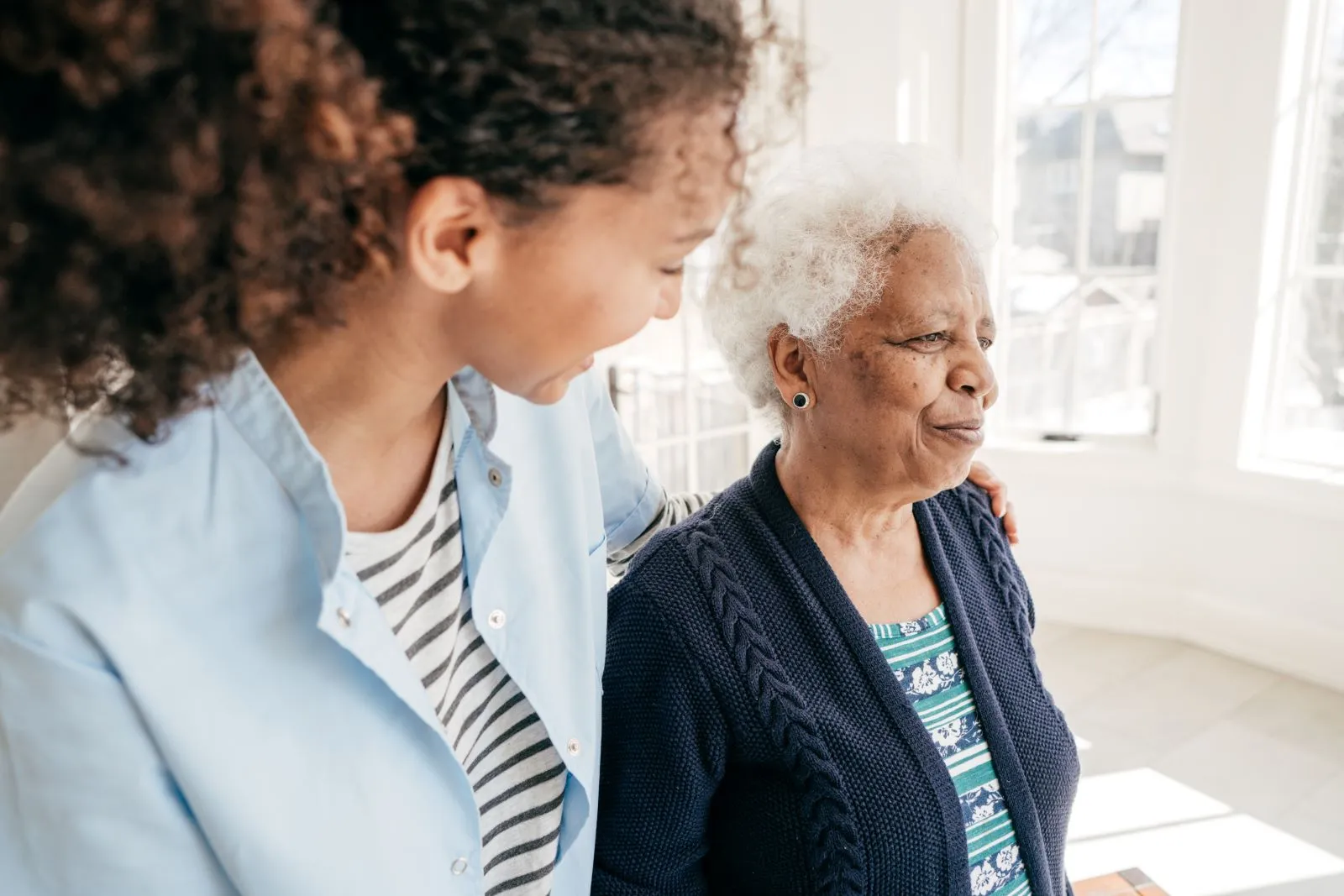 A Visiting Angels carer providing home care agency support to an elderly woman at home in Kidlington, Oxfordshire — compassionate, professional, CQC Good rated home care