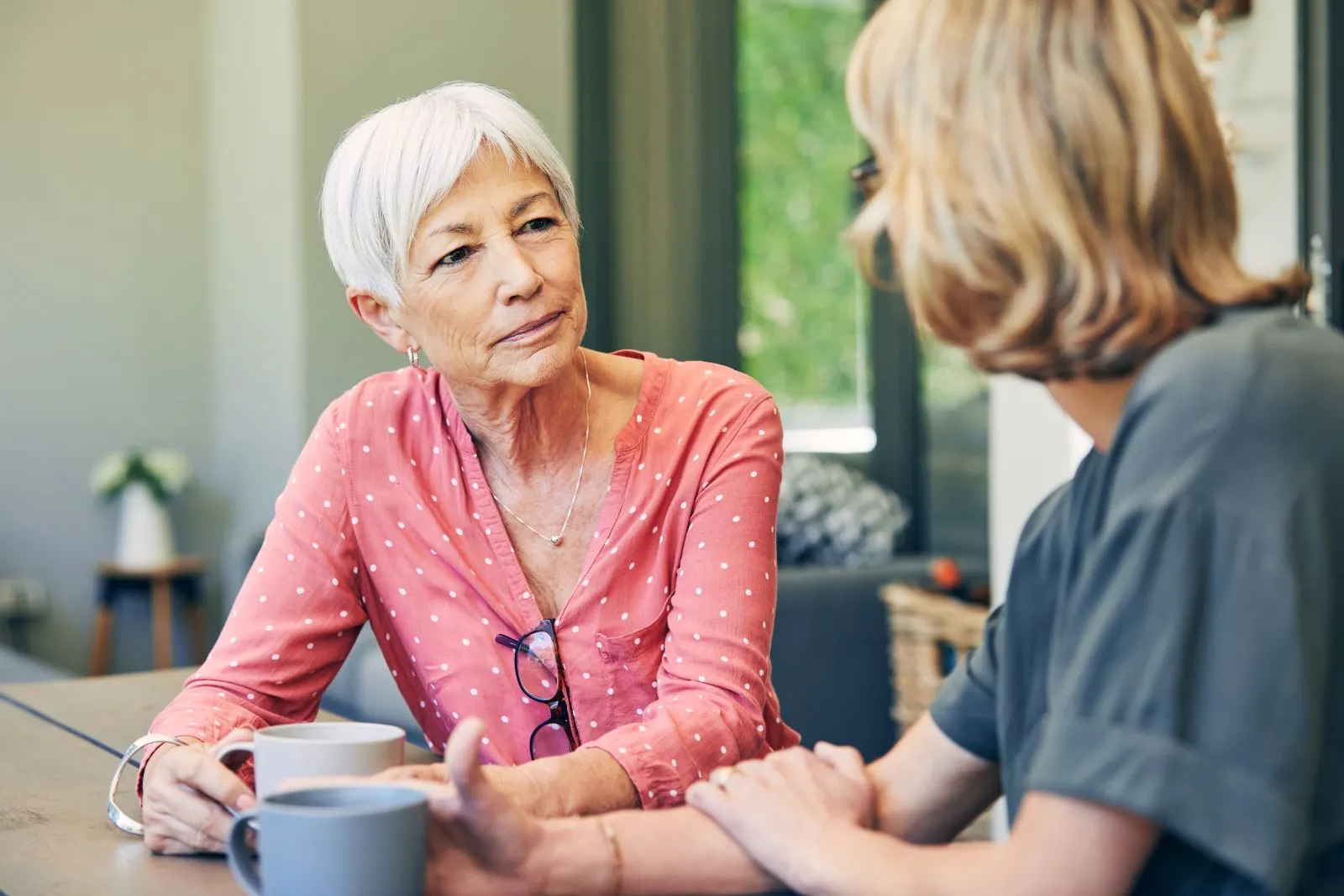 A Visiting Angels carer providing home care agency support to an elderly woman at home in Thame, Oxfordshire — compassionate, professional, CQC Good rated home care