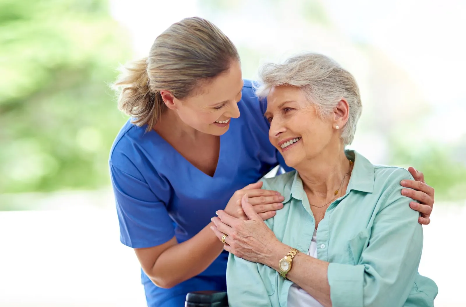 A Visiting Angels carer providing home care companionship to an elderly woman at home in Headington, Oxfordshire — compassionate, professional, CQC rated home care