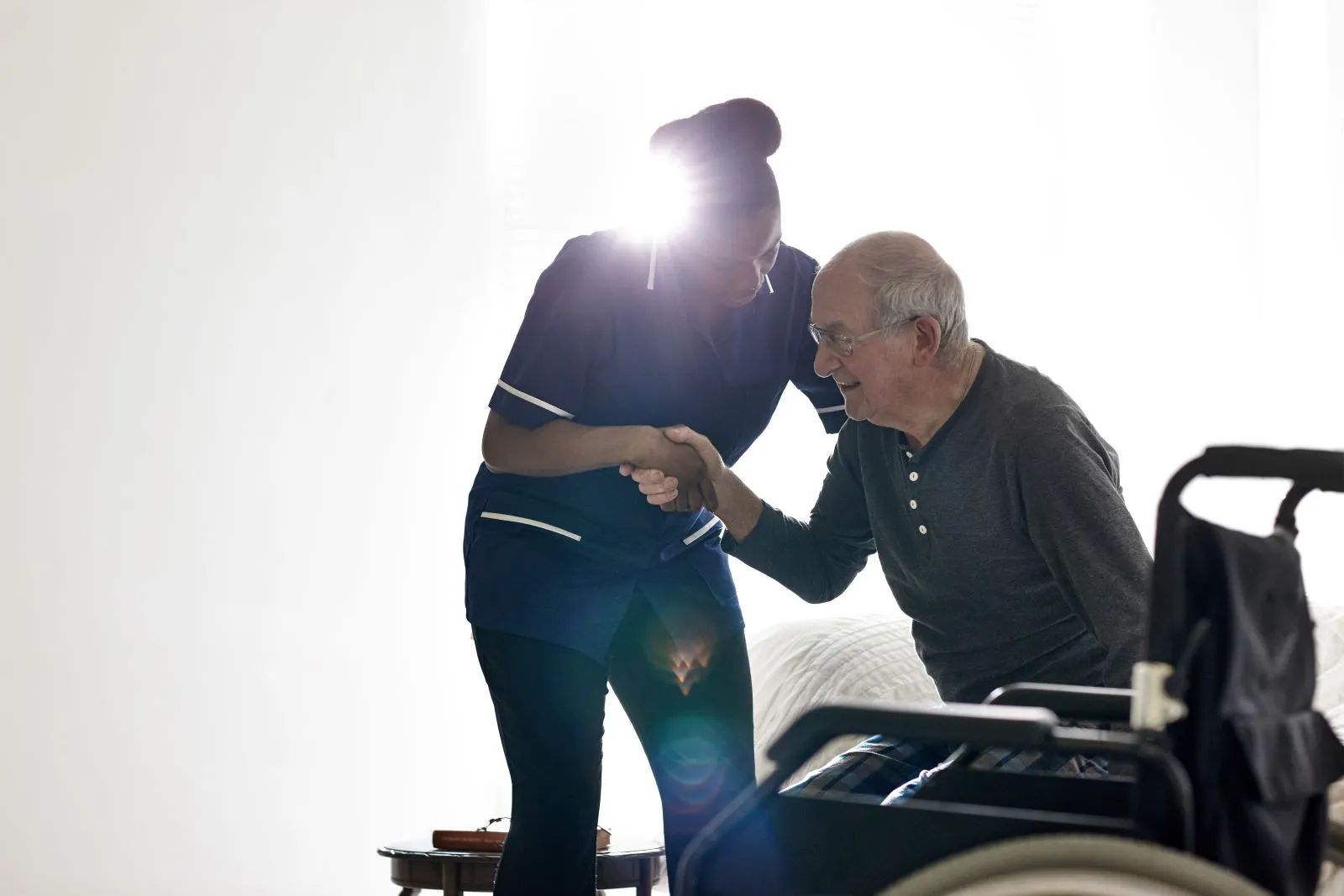 A Visiting Angels carer providing home care services to an elderly man at home in Bicester, Oxfordshire — compassionate, professional, CQC Good rated care