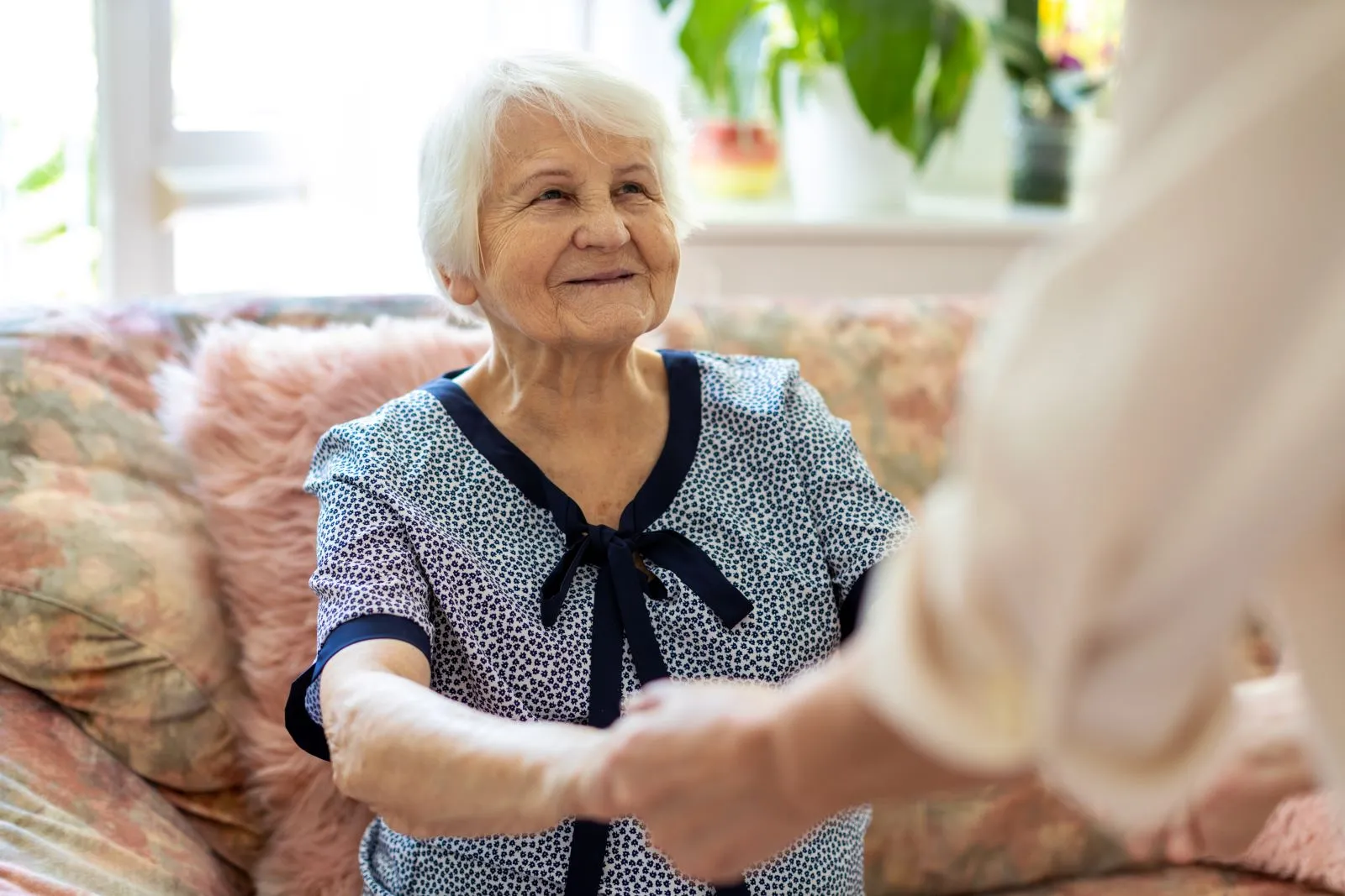 A Visiting Angels carer providing home care services to an elderly woman at home in Kidlington, Oxfordshire — compassionate, professional, CQC Good rated care