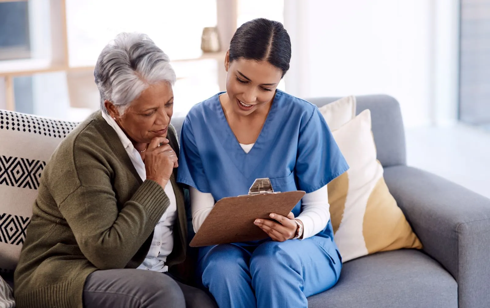A Visiting Angels carer providing home care to an elderly woman at home in Oxford, Oxfordshire — compassionate, professional, CQC Good rated home care