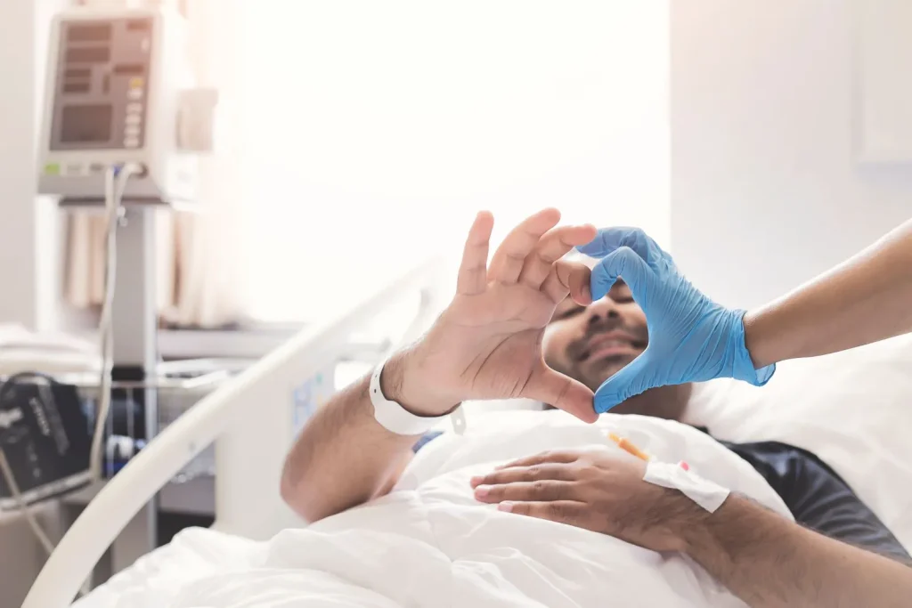 A Visiting Angels carer providing post hospital discharge care to an elderly man in Oxford, Oxfordshire — compassionate, professional, CQC rated home care