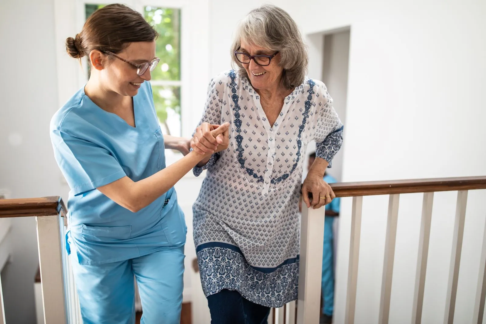 A Visiting Angels carer providing personal care to an elderly woman at home in Oxford, Oxfordshire — compassionate, professional, CQC Good rated home care