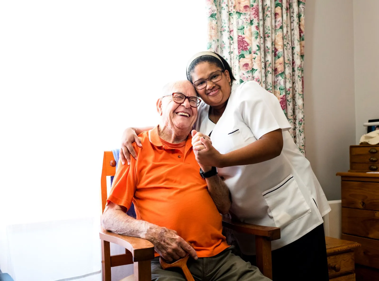 A Visiting Angels carer providing live‑in care to an elderly man at home in Abingdon, Oxfordshire — compassionate, professional, CQC rated home care