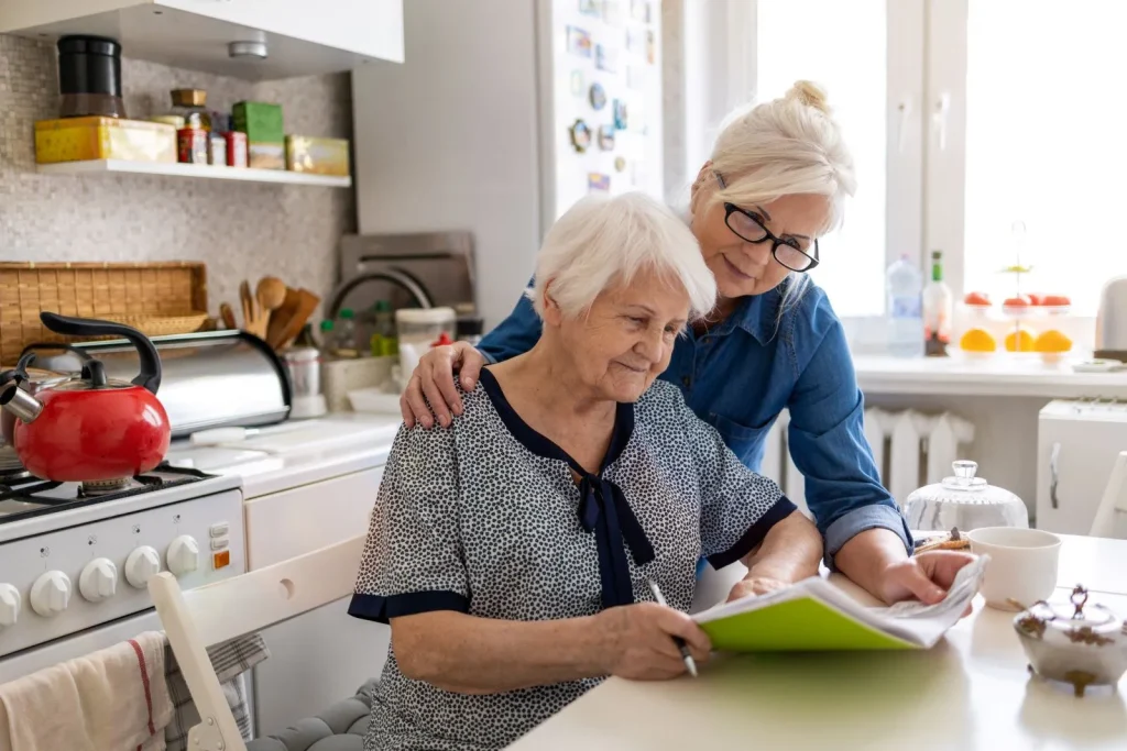 A Visiting Angels carer providing live‑in care to an elderly woman at home in Bicester, Oxfordshire — compassionate, professional, CQC Good rated home care