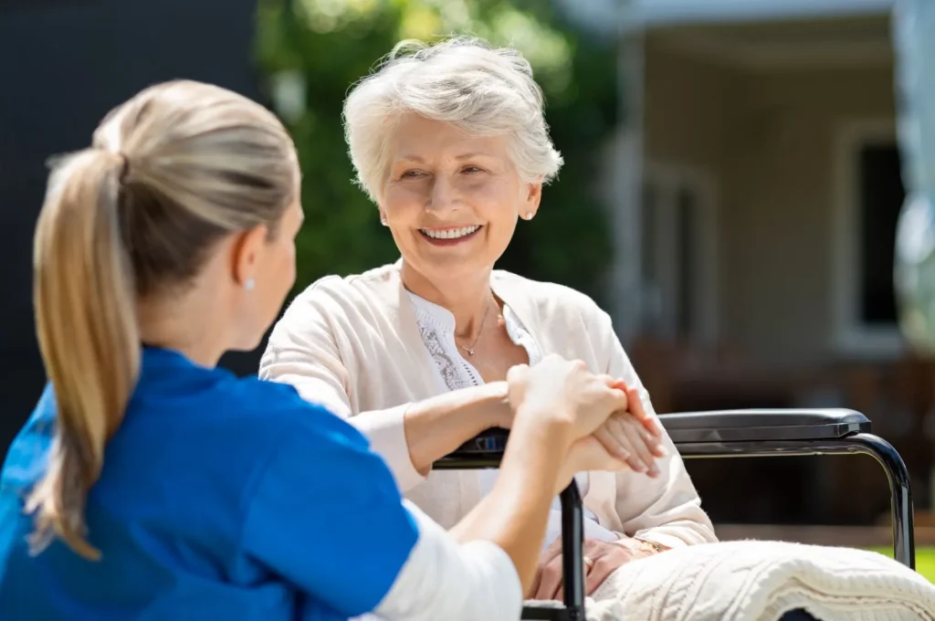 A Visiting Angels carer providing live‑in care services to an elderly woman in Wantage, Oxfordshire — compassionate, professional, CQC Good rated home care