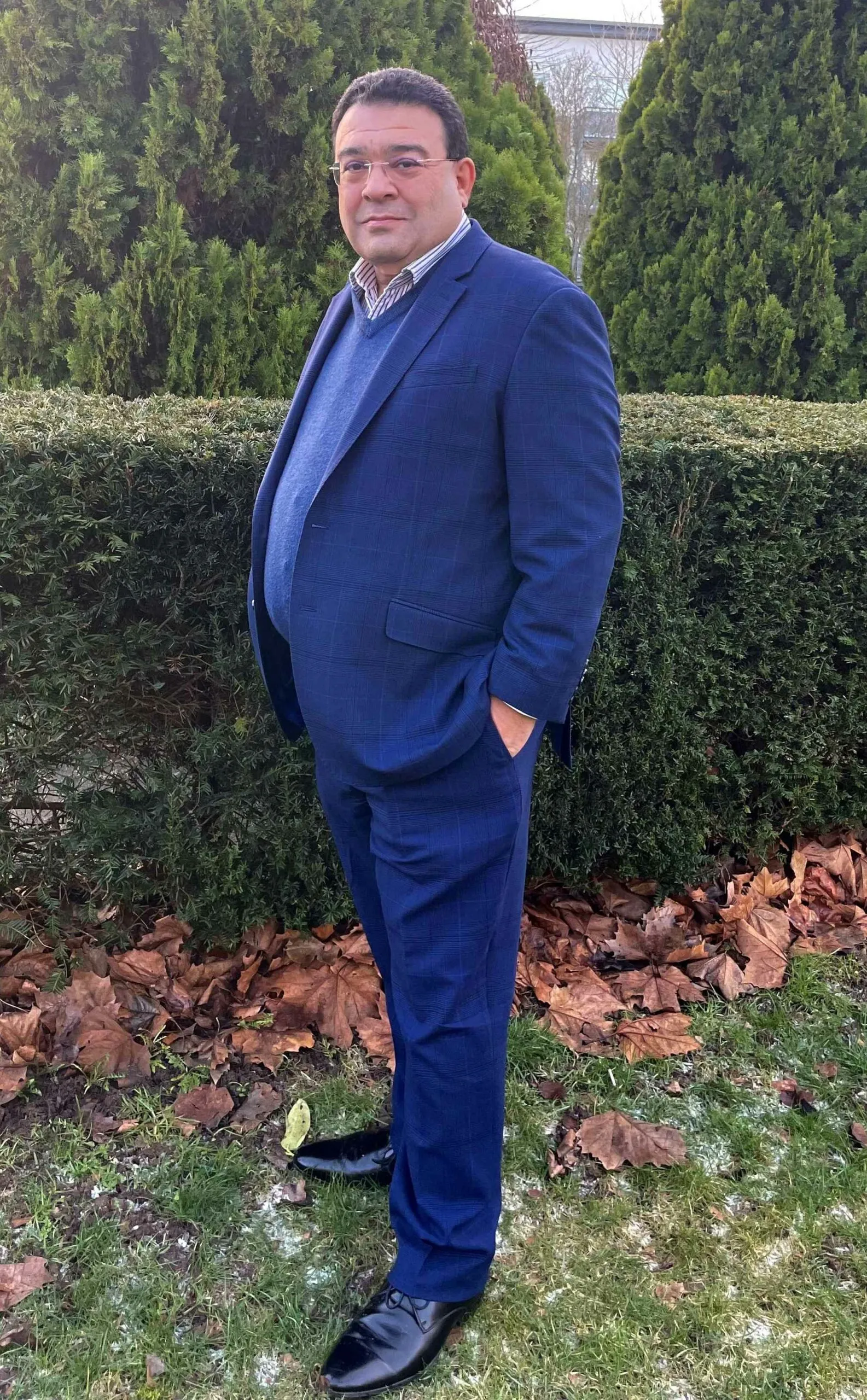 A local care entrepreneur representing local care business Oxford, standing outdoors in professional attire — compassionate, community‑focused, CQC rated home care