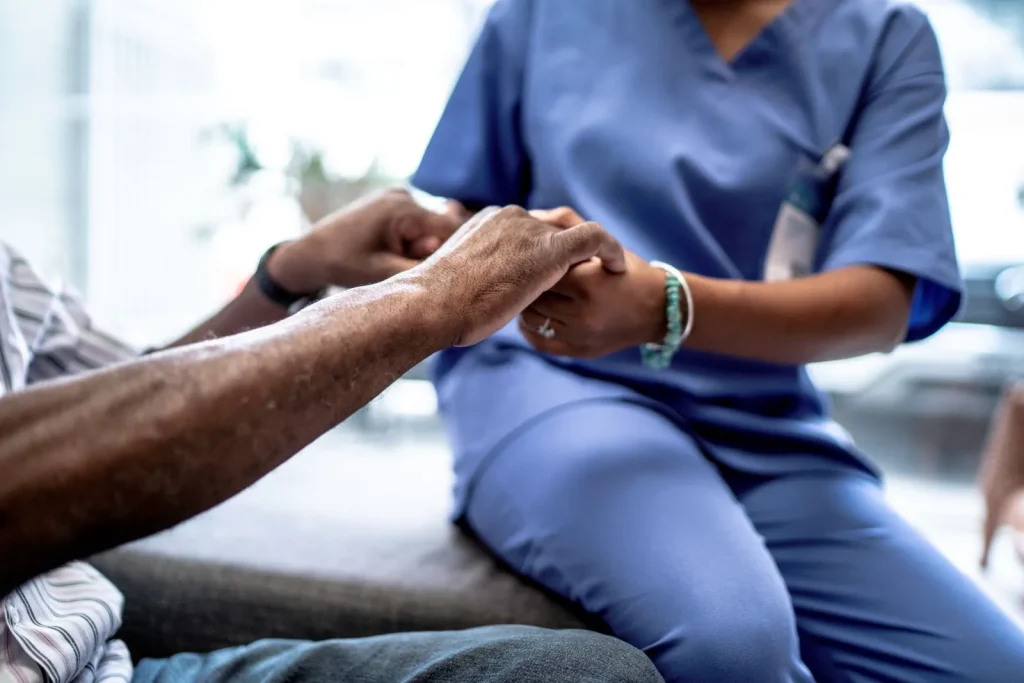 A Visiting Angels carer providing personal care to an elderly woman at home in Abingdon, Oxfordshire — compassionate, professional, CQC Good rated home care