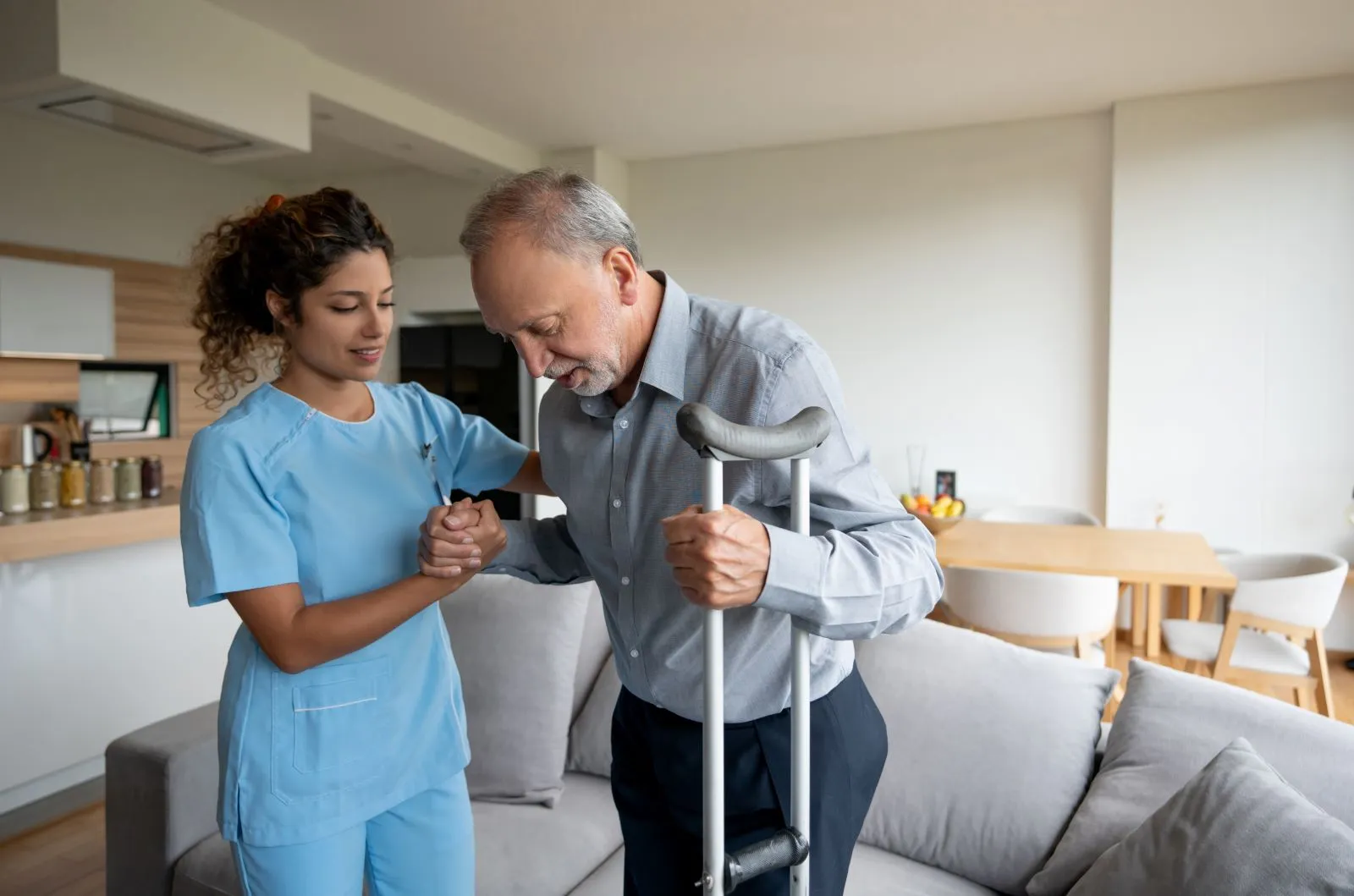 A Visiting Angels carer providing personal care services to an elderly man at home in Kidlington, Oxfordshire — compassionate, professional, CQC Good rated home care