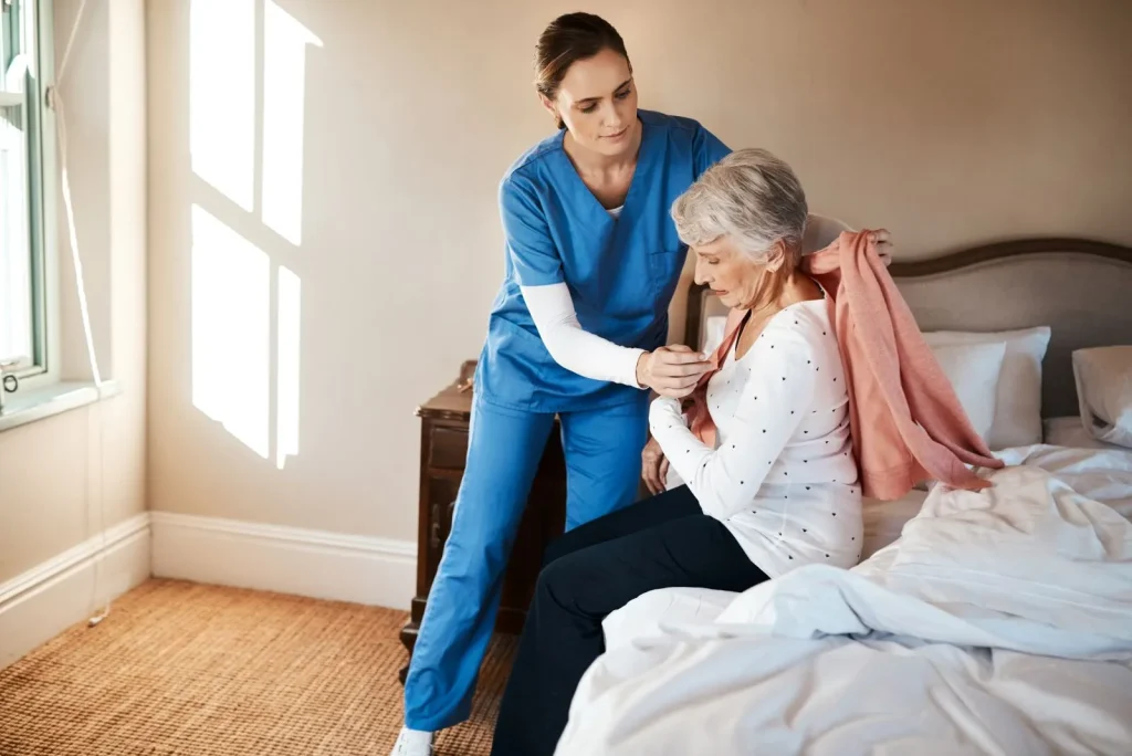 A Visiting Angels carer providing personal care to an elderly woman at home in Thame, Oxfordshire — compassionate, professional, CQC Good rated home care