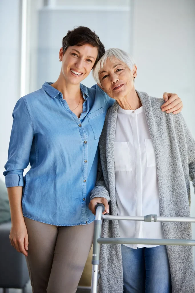 A Visiting Angels carer providing mobility and companionship care to an elderly woman in Woodstock, Oxfordshire — compassionate, professional, CQC rated home care