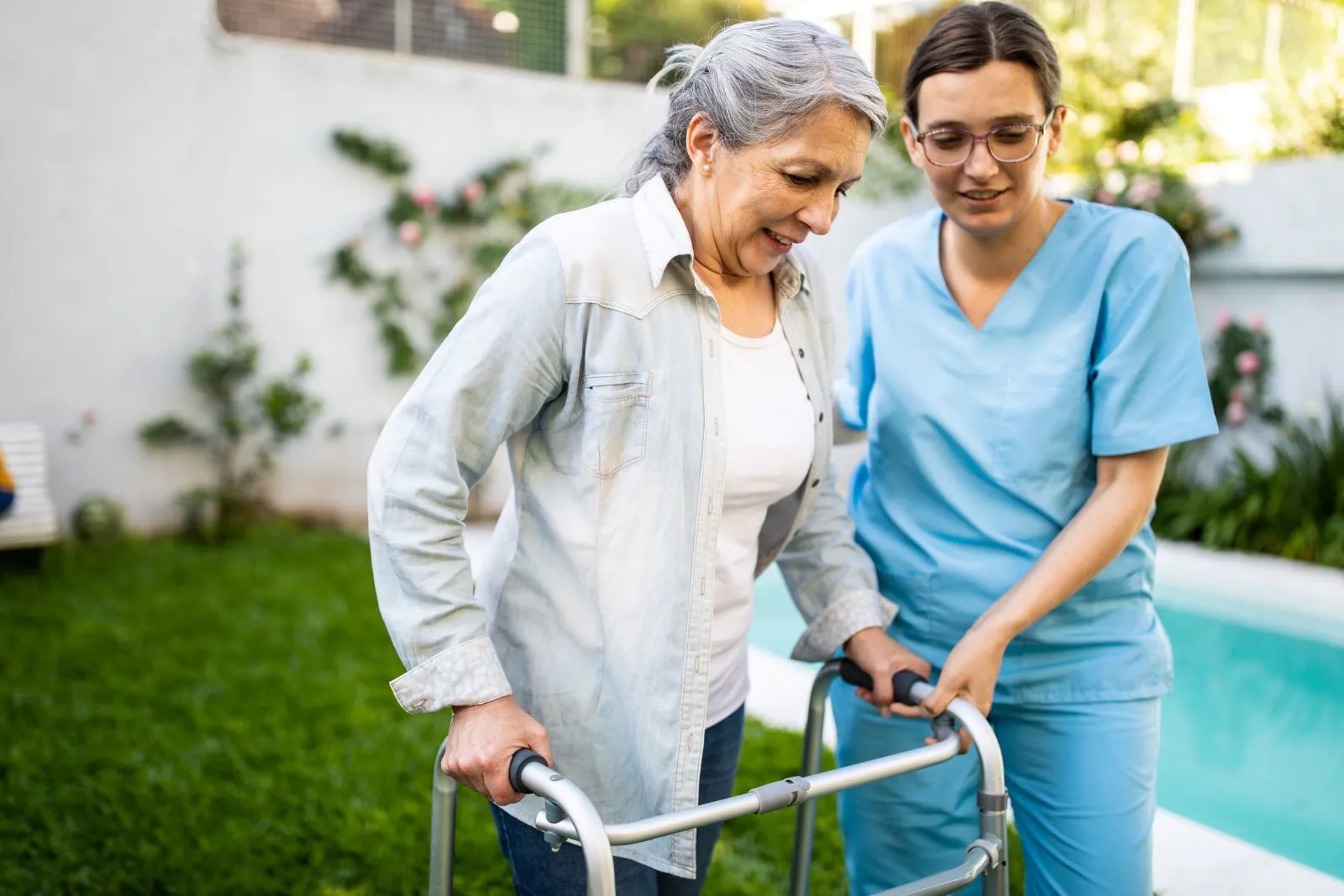 A Visiting Angels carer providing neurological and mobility care to an elderly woman at home in Oxford, Oxfordshire — compassionate, professional, CQC rated home care