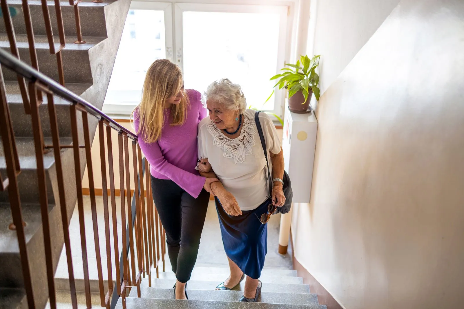 A Visiting Angels carer providing mobility and fall prevention care to an elderly woman at home in Kidlington, Oxfordshire — compassionate, professional, CQC rated home care