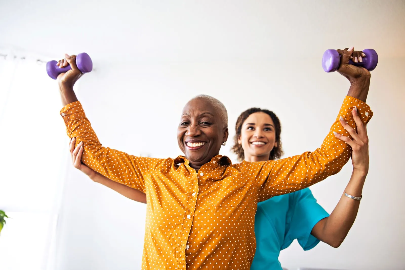 A Visiting Angels carer providing stroke recovery and fitness care to an elderly man in Kidlington, Oxfordshire — compassionate, professional, CQC rated home care