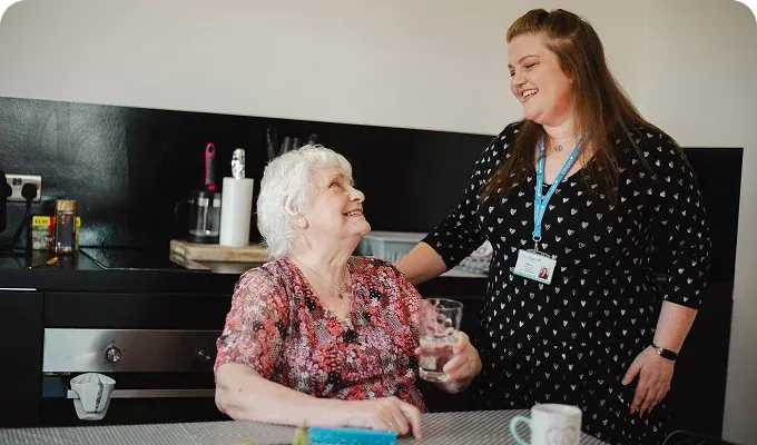 A Visiting Angels carer providing dementia care to an elderly woman in Summertown, Oxfordshire — compassionate, professional, CQC rated home care