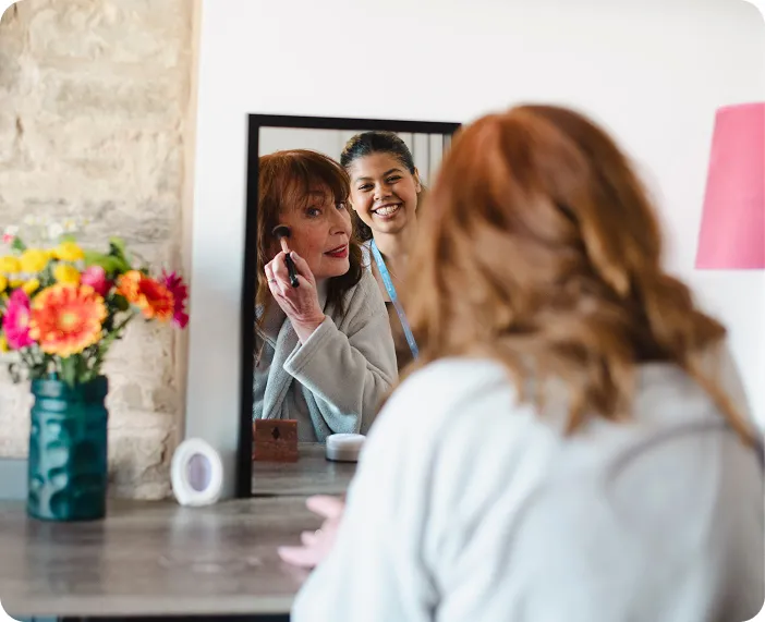 A Visiting Angels carer providing personal care and companionship to an elderly woman at home in Oxford, Oxfordshire — compassionate, professional, CQC rated home care