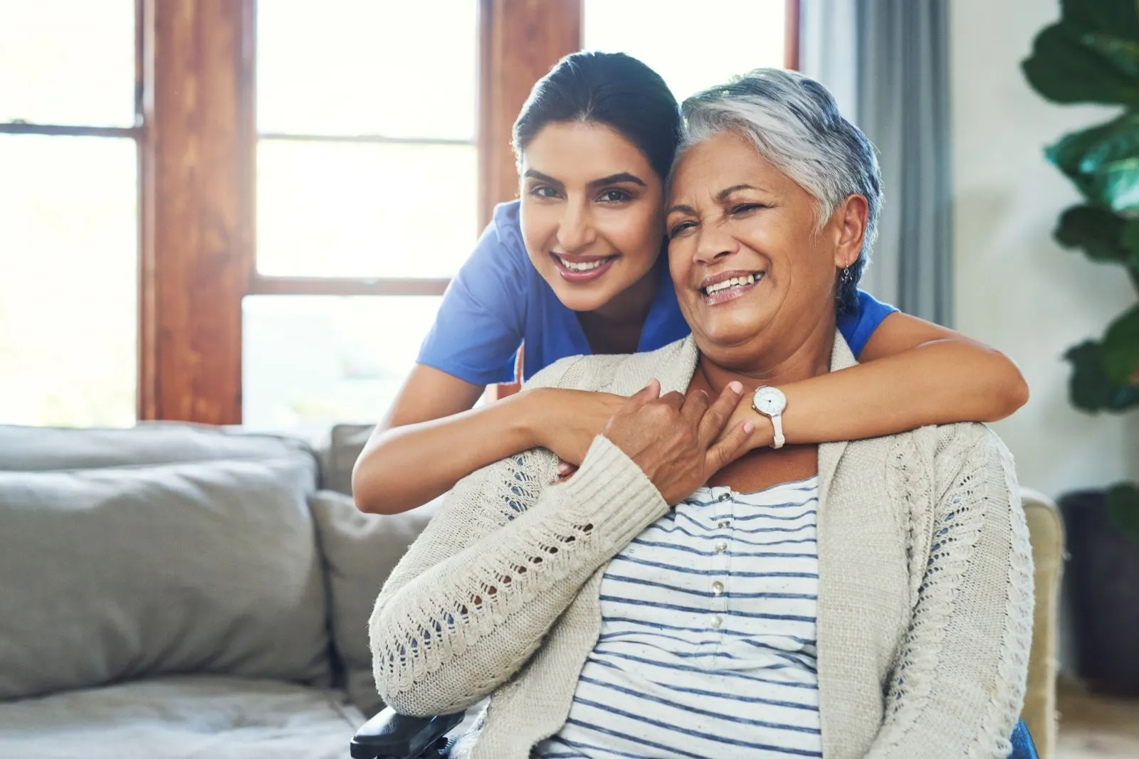 A Visiting Angels carer providing family support and respite care to an elderly woman in Thame, Oxfordshire — compassionate, professional, CQC rated home care