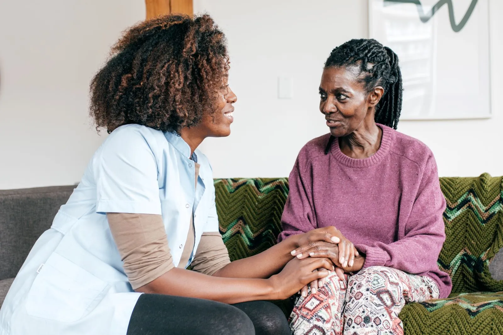 A Visiting Angels carer providing companionship and daily living support to an elderly woman at home in Thame, Oxfordshire — compassionate, professional, CQC rated home care