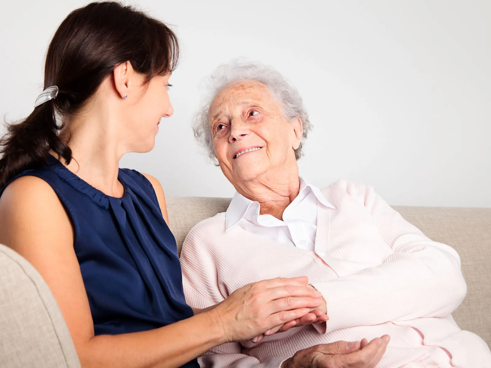 A Visiting Angels carer providing personal care and companionship to an elderly woman at home in Wheatley, Oxfordshire — compassionate, professional, CQC rated home care